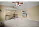 Living room features high ceilings, carpet, and a view of the kitchen at 1517 Cherry Hill Sw Rd, Conyers, GA 30094