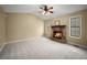 Living room features high ceilings, a stone fireplace, and two windows at 1517 Cherry Hill Sw Rd, Conyers, GA 30094