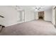 Spacious living room with a stone fireplace, a ceiling fan and access to a deck at 235 Shallowford Nw Rd, Kennesaw, GA 30144