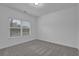 Bedroom featuring carpeted floors and a window with blinds at 3945 Hamilton Cove Ct, Cumming, GA 30028