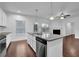 Kitchen island with a granite countertop and stainless steel appliances at 3945 Hamilton Cove Ct, Cumming, GA 30028