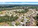 An aerial view of the property showcasing mature trees and the surrounding neighborhood at 1606 Kenilworth Se Ln, Conyers, GA 30013