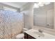 Simple bathroom with a polka dot shower curtain and modern vanity at 1606 Kenilworth Se Ln, Conyers, GA 30013