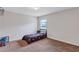 Cozy bedroom with carpet, featuring a single bed under a window, and a basketball hoop fixed to the wall at 1606 Kenilworth Se Ln, Conyers, GA 30013
