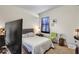 Cozy bedroom with neutral walls, window with curtains, and comfortable bed at 1606 Kenilworth Se Ln, Conyers, GA 30013