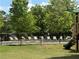 Relax by the community pool with lounge chairs and landscaped surroundings, ideal for enjoying sunny days at 1606 Kenilworth Se Ln, Conyers, GA 30013