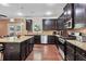 Well-equipped kitchen with stainless steel appliances, granite countertops, and dark cabinets at 1606 Kenilworth Se Ln, Conyers, GA 30013