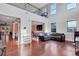 Bright and airy living room with high ceilings, large windows, and hardwood floors at 1606 Kenilworth Se Ln, Conyers, GA 30013