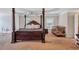 Spacious main bedroom featuring a four-poster bed and tray ceilings at 1606 Kenilworth Se Ln, Conyers, GA 30013