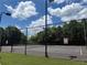 Private community tennis courts with lush landscaping and well-maintained playing surface at 1606 Kenilworth Se Ln, Conyers, GA 30013