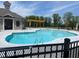 Community swimming pool featuring a pergola with outdoor seating and a sun deck on a beautiful day at 627 Silva St # 127, Cumming, GA 30040
