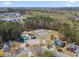 Community aerial view showcases pool, tennis courts, mature trees and well maintained surrounding properties at 1056 Fern Valley Way, Dacula, GA 30019