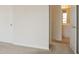 Neutral bedroom with adjoining bathroom, featuring carpet flooring and neutral paint at 1056 Fern Valley Way, Dacula, GA 30019