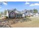 Charming single-story home with brick and siding, landscaped yard, and well-manicured bushes at 1056 Fern Valley Way, Dacula, GA 30019