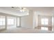 Spacious living room with ample natural light, carpet flooring, and open floor plan at 1056 Fern Valley Way, Dacula, GA 30019