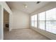 Inviting living room filled with natural light has a fireplace and neutral carpet at 1056 Fern Valley Way, Dacula, GA 30019