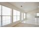 Bright sunroom with large windows, tile flooring, and access to the backyard at 1056 Fern Valley Way, Dacula, GA 30019