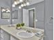 Bathroom with vanity, sink, large mirror and neutral paint at 1281 Branch Dr, Tucker, GA 30084