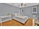 Well-lit bedroom with hardwood floors, gray walls, and modern furnishings at 1281 Branch Dr, Tucker, GA 30084
