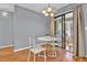 Eat-in dining area features a round table, sliding glass doors to the patio and wood flooring at 1281 Branch Dr, Tucker, GA 30084