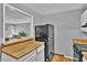 Open-concept kitchen features a breakfast bar and a view into the living area at 1281 Branch Dr, Tucker, GA 30084