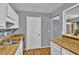 Bright kitchen with butcher block countertops, stainless steel sink, and direct access to the living area at 1281 Branch Dr, Tucker, GA 30084
