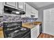 This well-maintained kitchen features stainless steel appliances, modern backsplash and butcher block counters at 1281 Branch Dr, Tucker, GA 30084