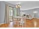 Open concept living room with dining area, neutral paint, and hardwood flooring at 1281 Branch Dr, Tucker, GA 30084