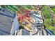 An aerial view showcases the backyard patio space, nestled amongst lush landscaping and mature trees at 1287 University Ne Dr, Atlanta, GA 30306