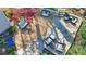 An aerial view highlights the backyard patio and multiple seating areas surrounded by mature landscaping at 1287 University Ne Dr, Atlanta, GA 30306