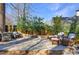Charming stone back patio with ample seating is perfect for entertaining guests outdoors at 1287 University Ne Dr, Atlanta, GA 30306