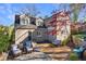 Landscaped backyard features a stone patio and seating area with beautiful plantings and mature trees at 1287 University Ne Dr, Atlanta, GA 30306