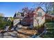 Landscaped backyard features a stone patio and seating area with beautiful plantings and mature trees at 1287 University Ne Dr, Atlanta, GA 30306
