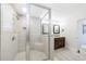 Bathroom with glass enclosed tiled shower and dark wood vanity at 1287 University Ne Dr, Atlanta, GA 30306