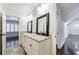 Bright bathroom featuring double sinks, granite countertops, and framed mirrors at 1287 University Ne Dr, Atlanta, GA 30306