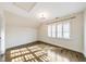 A light-filled bedroom with plantation shutters and wood floors at 1287 University Ne Dr, Atlanta, GA 30306