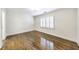 Bright bedroom with hardwood floors, white walls, and natural light at 1287 University Ne Dr, Atlanta, GA 30306
