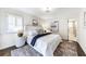 Bedroom with neutral walls, hardwood floors, and a comfortable bed with plush pillows at 1287 University Ne Dr, Atlanta, GA 30306