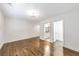 A neutral bedroom with hardwood floors and doorways to bathroom and hallways at 1287 University Ne Dr, Atlanta, GA 30306