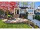 Charming home with stone patio, lush lawn, and vibrant trees at 1287 University Ne Dr, Atlanta, GA 30306