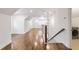Hallway with hardwood floors, white trim, and laundry area off to the side at 1287 University Ne Dr, Atlanta, GA 30306