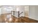 Bright hallway with hardwood floors and white trim and railing plus abundant natural light at 1287 University Ne Dr, Atlanta, GA 30306
