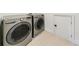 A laundry room with a front-loading washer and dryer at 1287 University Ne Dr, Atlanta, GA 30306