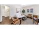 Comfortable living room featuring hardwood floors and a stylish white couch and art at 1287 University Ne Dr, Atlanta, GA 30306