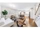 Spacious living area open to a modern kitchen with hardwood floors at 1287 University Ne Dr, Atlanta, GA 30306