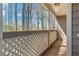 Balcony with privacy lattice overlooks trees and landscape at 2209 N Forest Trl, Dunwoody, GA 30338