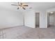 Bedroom with neutral carpet, walk-in closet and open doorway to hallway at 2209 N Forest Trl, Dunwoody, GA 30338