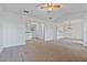 Open-concept living room with neutral carpet, abundant natural light and high ceilings at 2209 N Forest Trl, Dunwoody, GA 30338