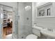 Bathroom with glass enclosed shower, a toilet and a pedestal sink at 573 Amsterdam Ne Ave, Atlanta, GA 30306