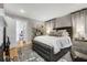 Spacious bedroom with a fireplace, elegant shelving, and a king-sized bed at 573 Amsterdam Ne Ave, Atlanta, GA 30306